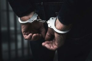 Man Arrested, In Handcuffs